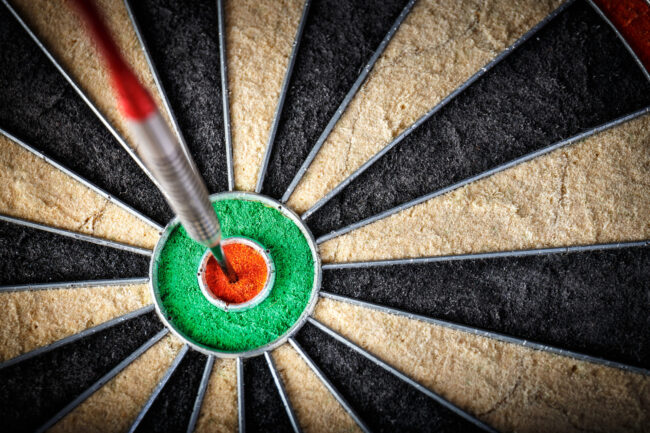 the darts in bull’s eye, close up